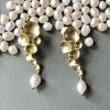 white pearl gold earrings.png